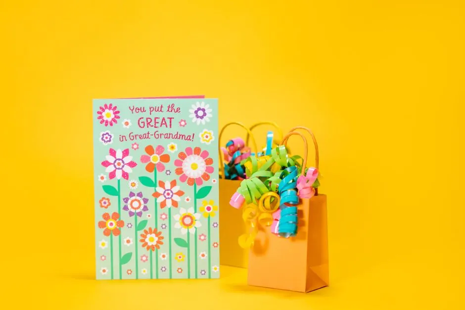 A greeting card resting beside a gift bag, illustrative photo
